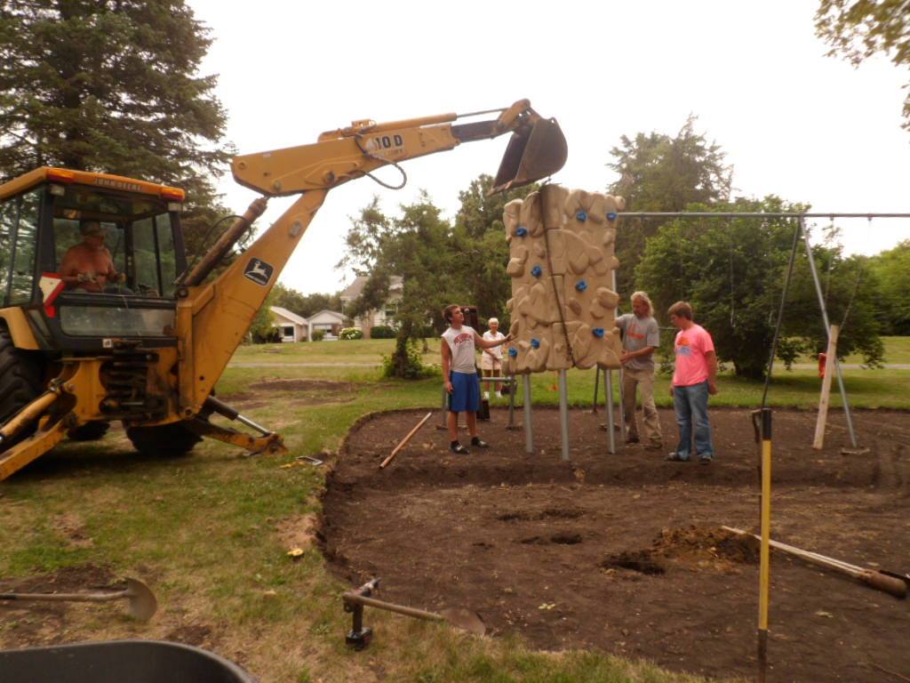 Crew installing new playground equipment at Plover City Park