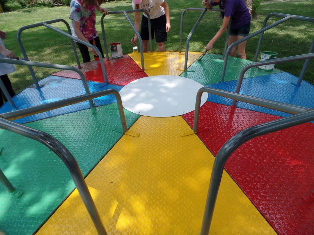 Painting playground equipment at Plover City Park